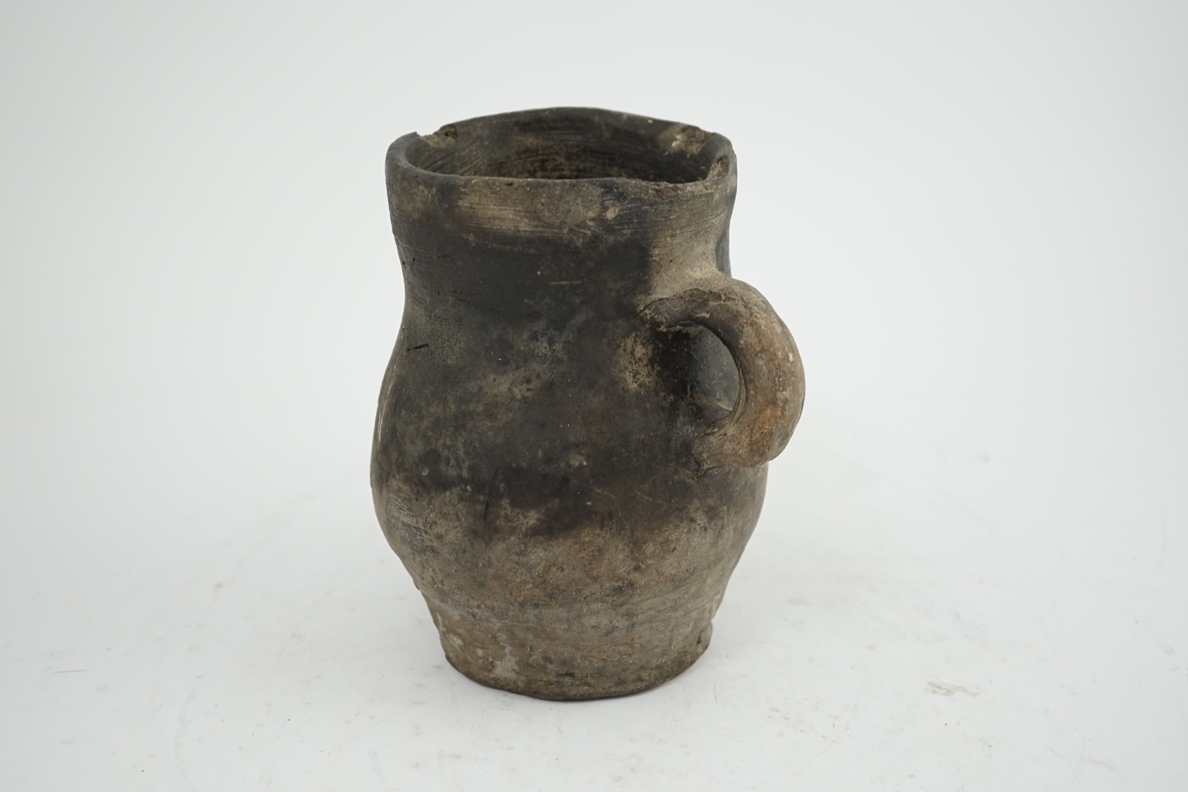 An archaic pottery jug, Iron Age, excavated in Britain